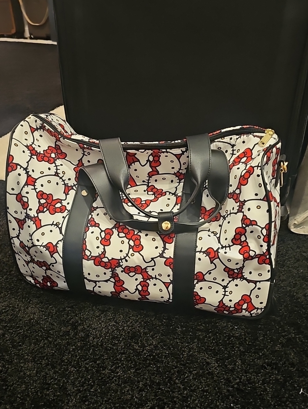 Hello Kitty White Travel Duffel with Red Bow Print and Black Trim